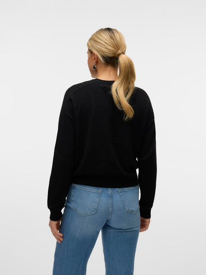Γυναικεία μαύρη πλεκτή ζακέτα VERO MODA με ανάλαφρη πλέξη, πίσω όψη που δείχνει την κανονική εφαρμογ